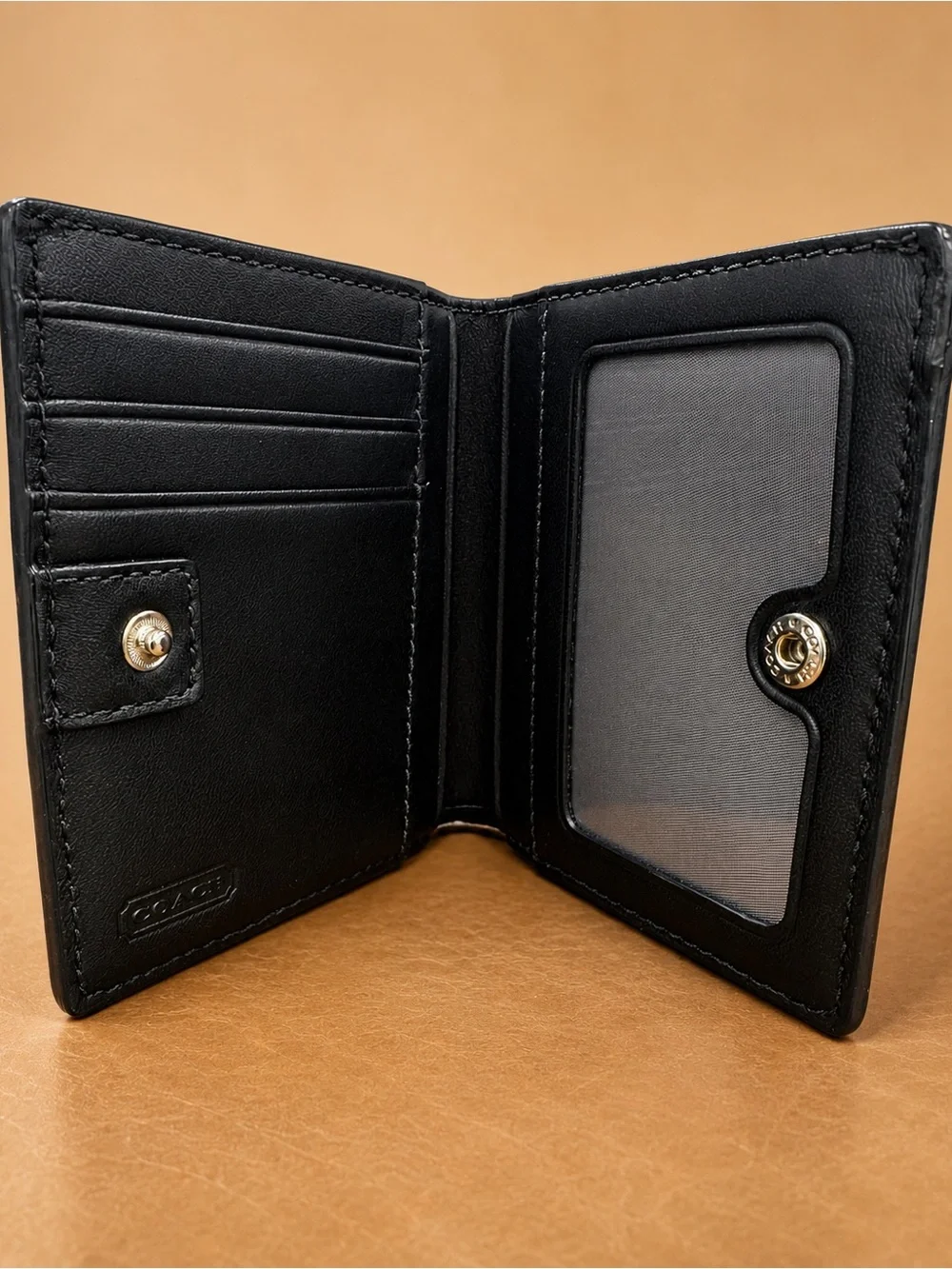 Coach Black Leather Compact Wallet with Embossed Logo